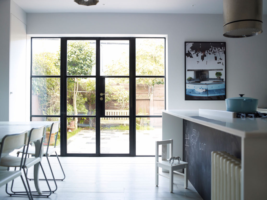 metal window frames and door screen in kitchen