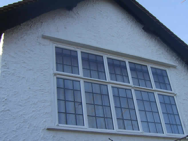 White leaded metal frame windows