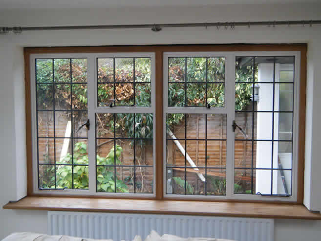 White leaded window into oak surrounds