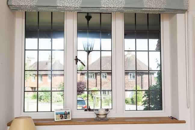 Photo from the inside of a house featuring slimline metal windows.