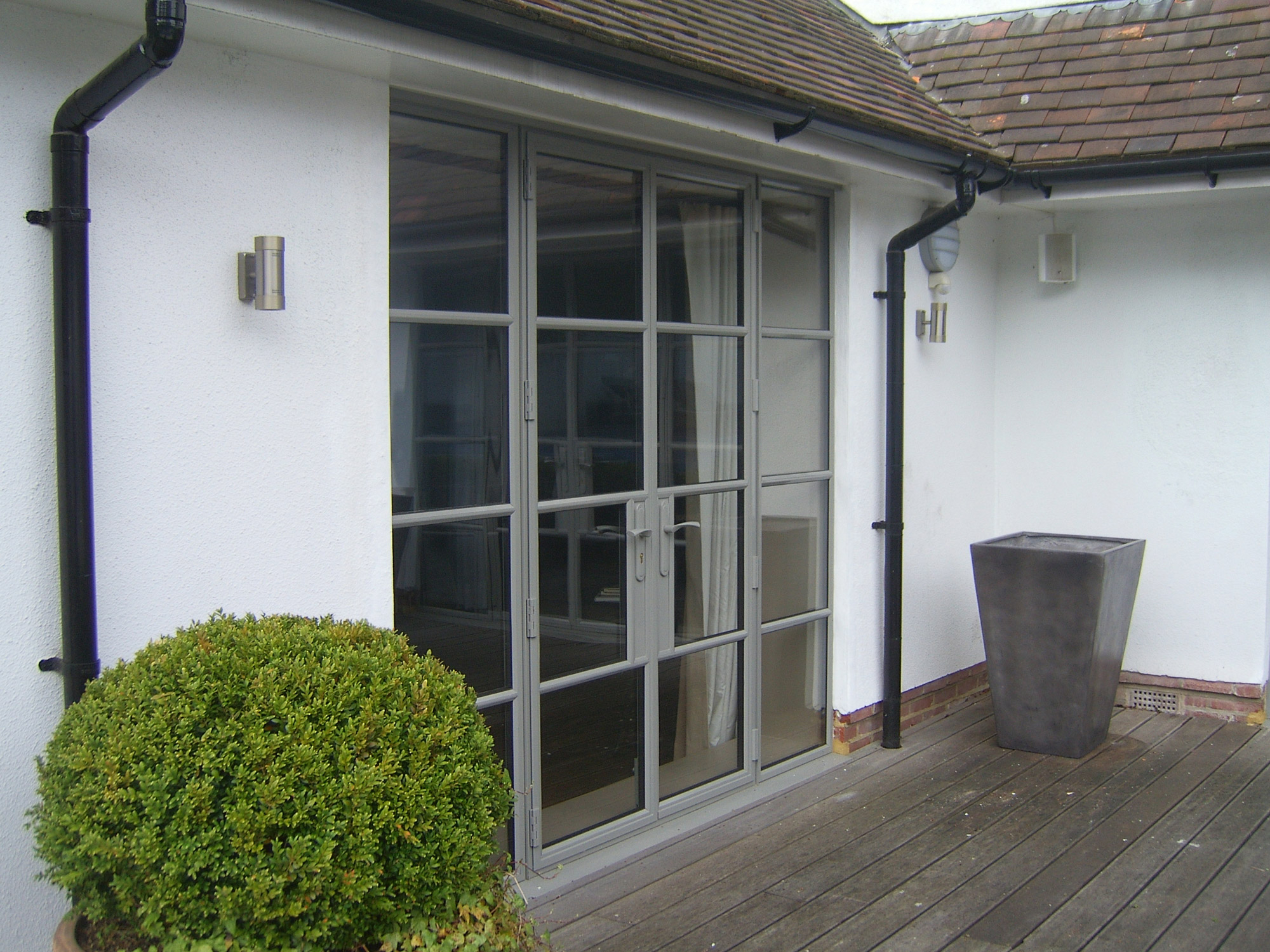 grey steel windows and door screens